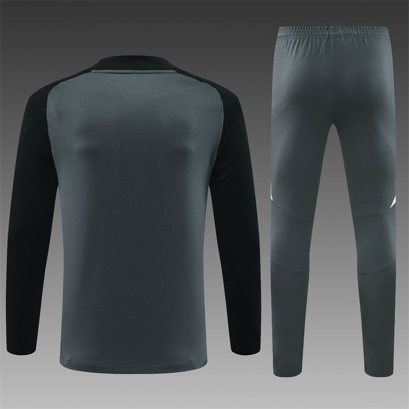 2024/2025 Manchester United Tracksuit - featuring a stylish grey color with black and red accents.