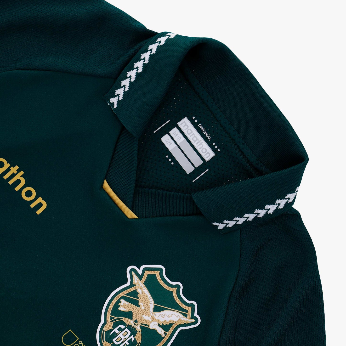 Close-up of the Bolivia 2025 Marathon Centenary Home Jersey crest with '100' inscription beneath it