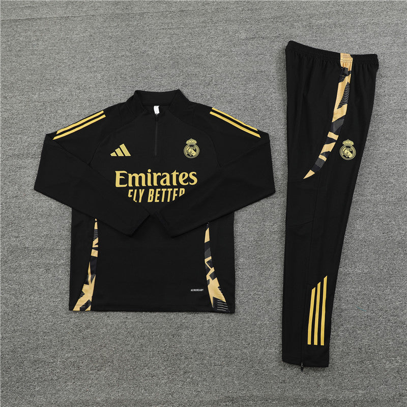 Close-up of the Real Madrid kids black tracksuit, highlighting the zipper and embroidery