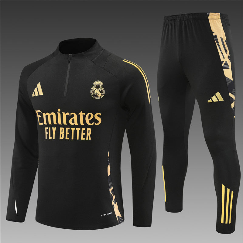 Real Madrid black kids tracksuit front view featuring the club logo and sleek design