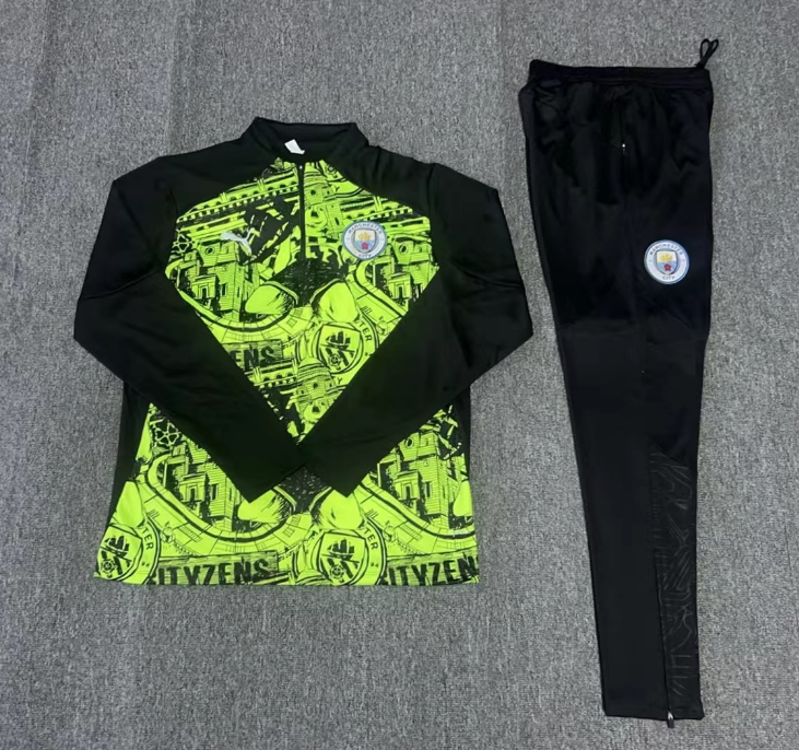 Front view of Manchester City 2024/25 black and green tracksuit