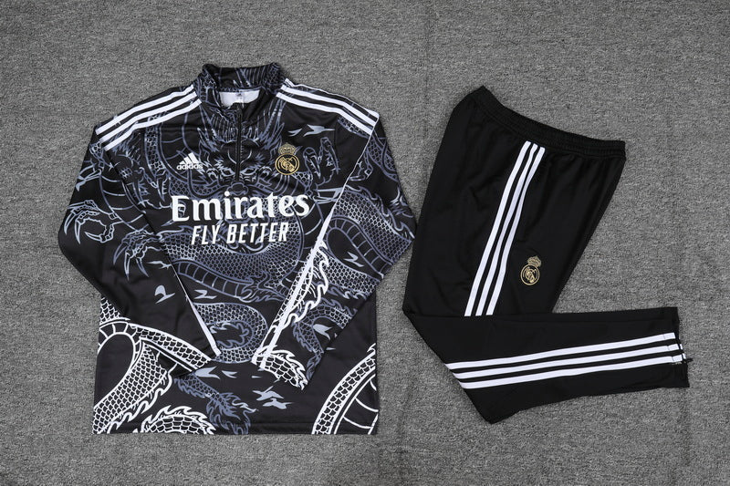 Real Madrid black training suit with gold accents and dragon design