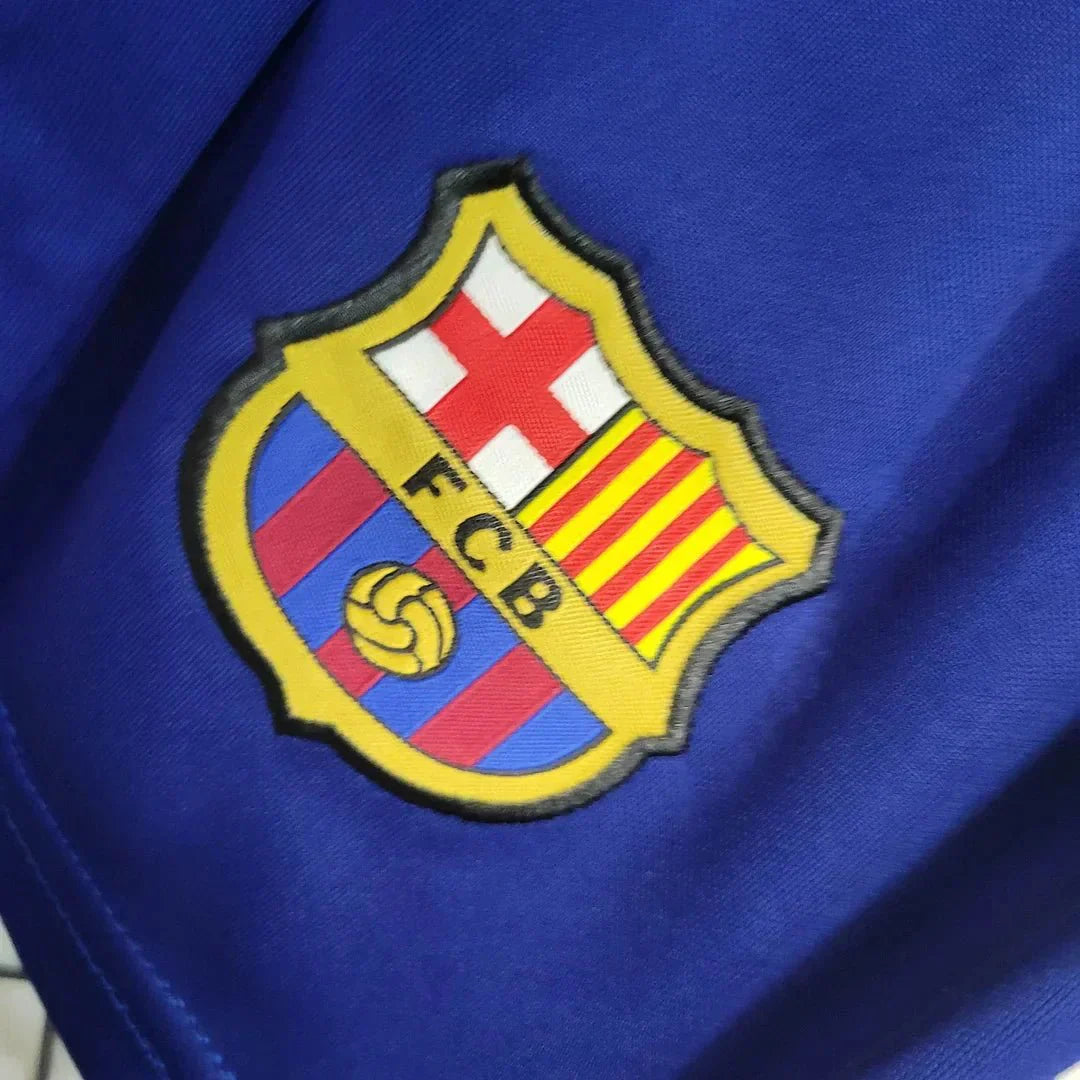 Young fan in FC Barcelona home kit 2023