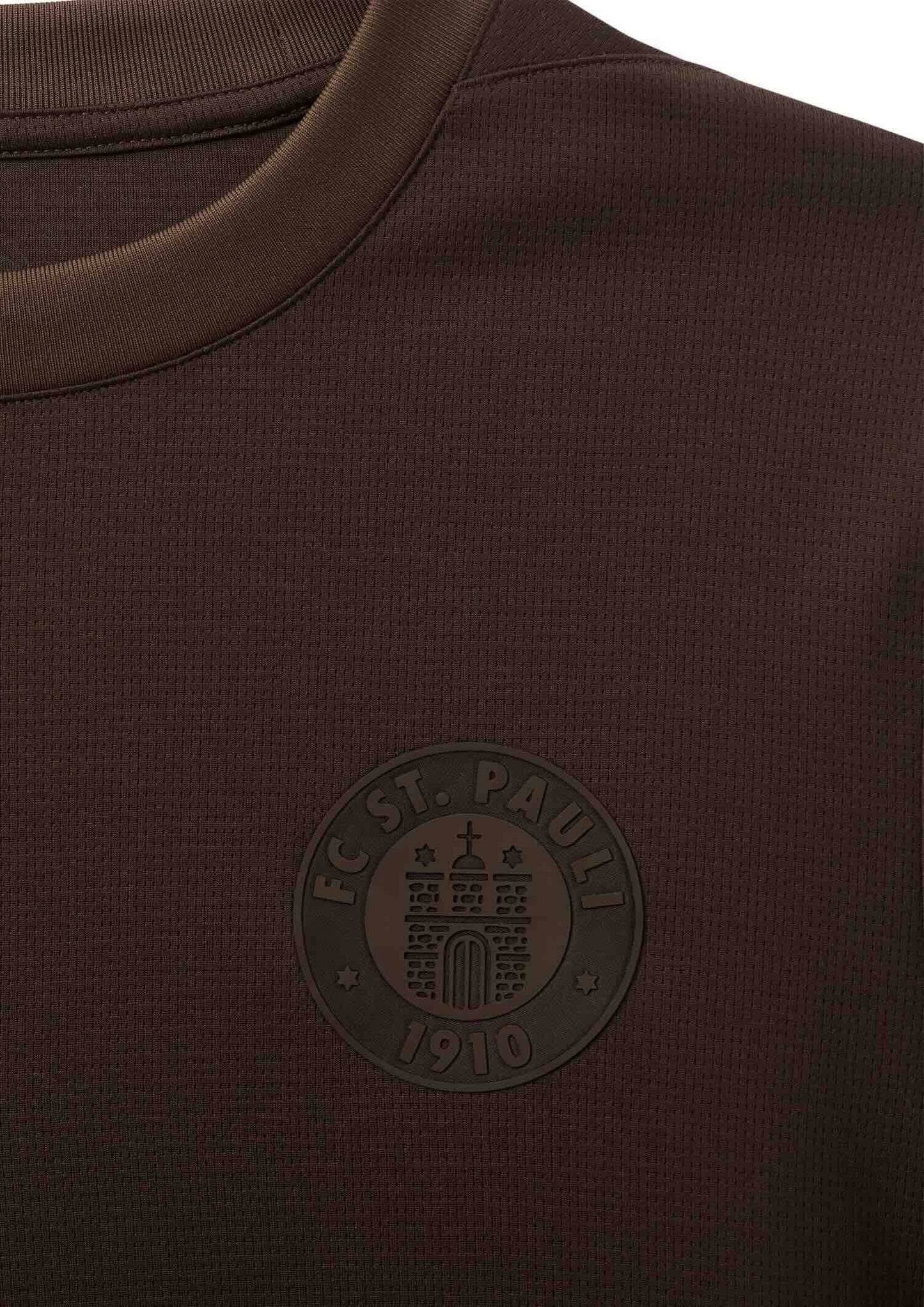 St. Pauli 2025 No Place for Racism jersey paired with matching brown FC ST PAULI 1910 logo