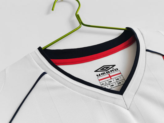 Front view of the 2002 England Home Long Sleeve Kit, highlighting the England crest and Umbro logo
