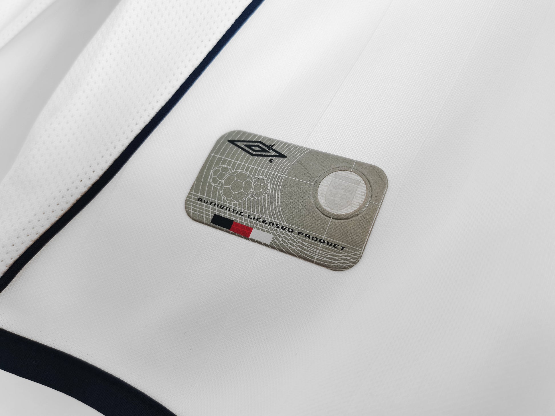 Close-up of the 2002 England Home Jersey, displaying the detailed stitching and long sleeves