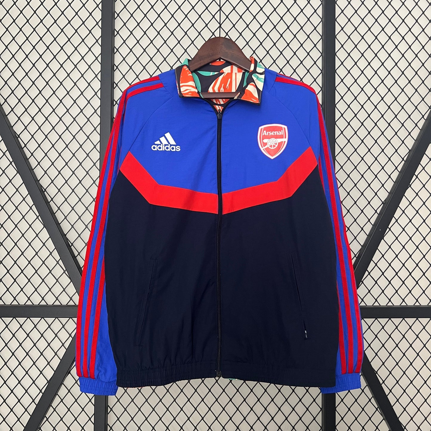 Arsenal reversible jacket with bold abstract print and classic red-blue style