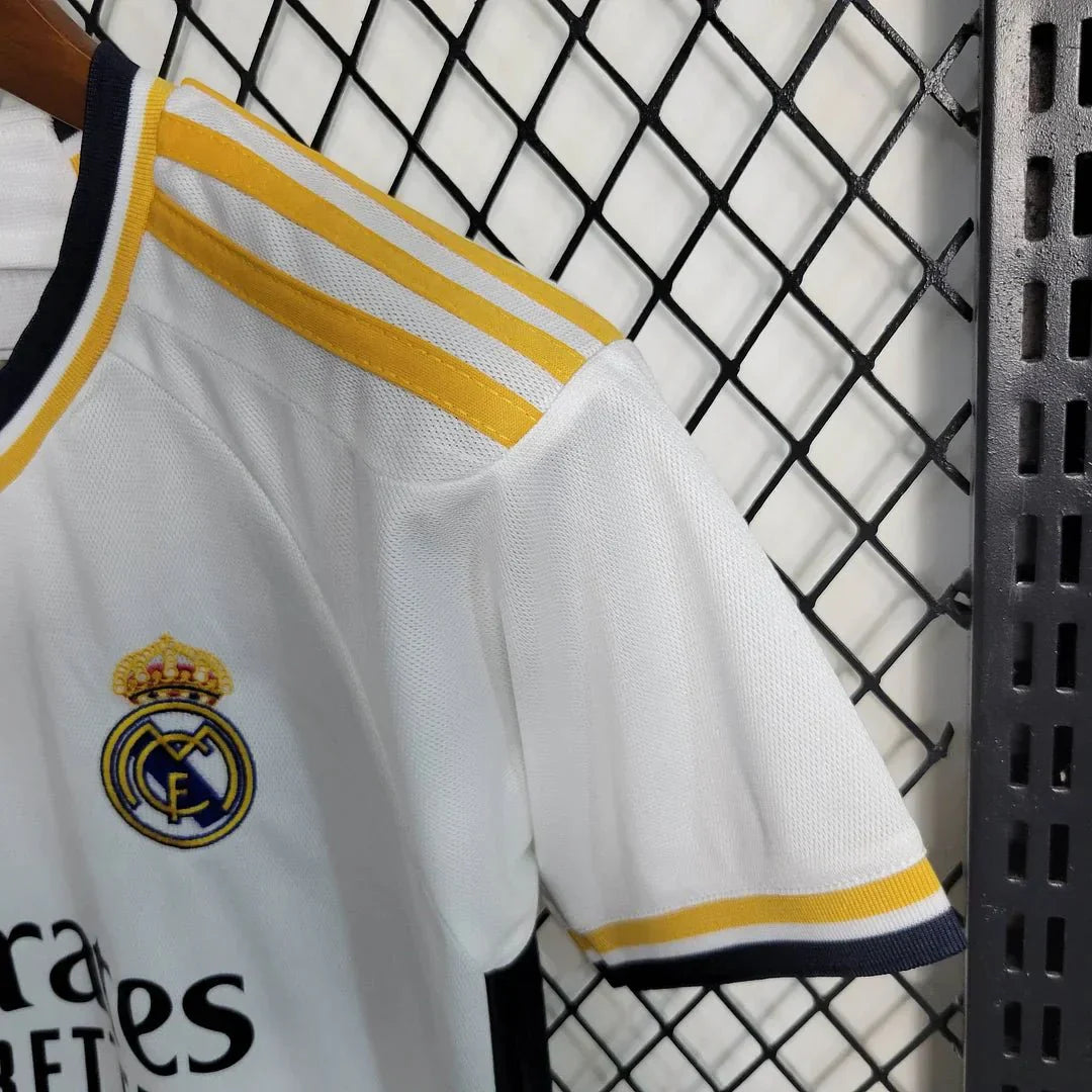 Child in 2023 Real Madrid official football uniform