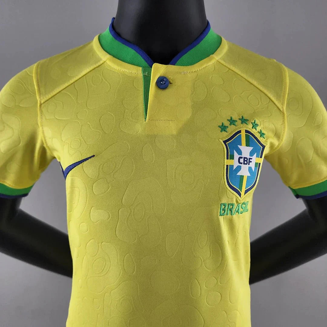 Child in Brazil national football uniform 2022