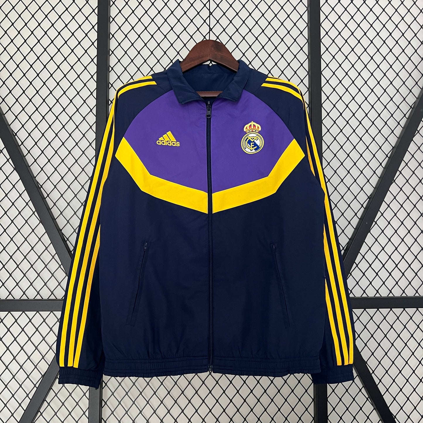 Close-up of Real Madrid club crest on trench coat