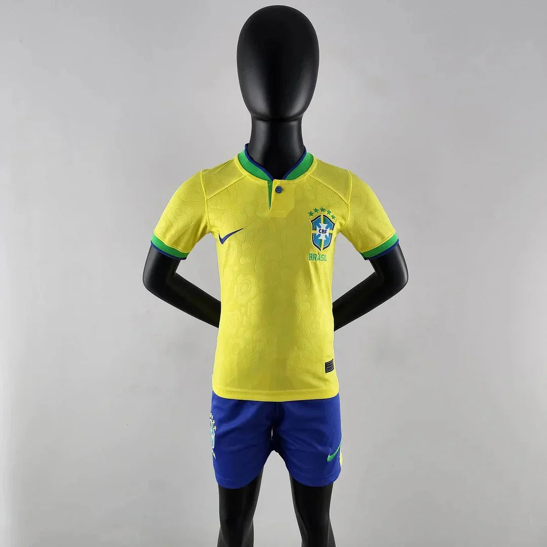 Kids wearing Brazil 2022 yellow jersey and blue shorts