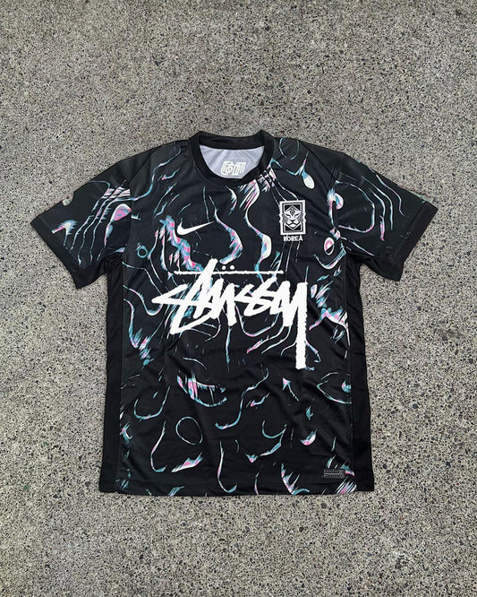 Korea x Stussy Special Edition Black Jersey Front View showcasing the sleek design