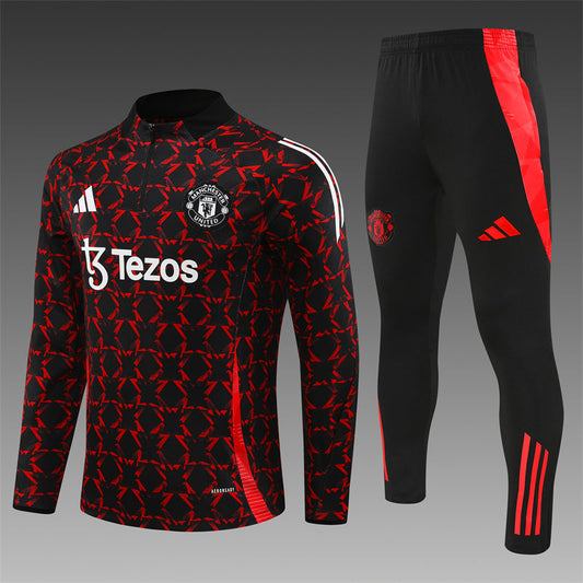 Manchester United 2024/2025 Black and Red Tracksuit – A close-up shot of the official tracksuit showing the sleek black and red design with the Manchester United logo